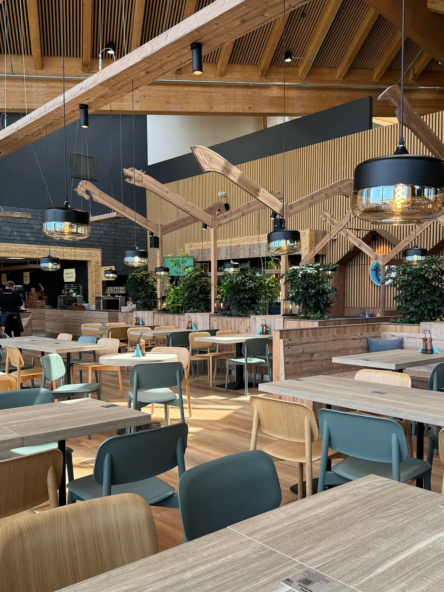 Spacious dining area with contract-grade tables and chairs in a contemporary resort interior at Nordborg Resort, designed for high-capacity hospitality use.