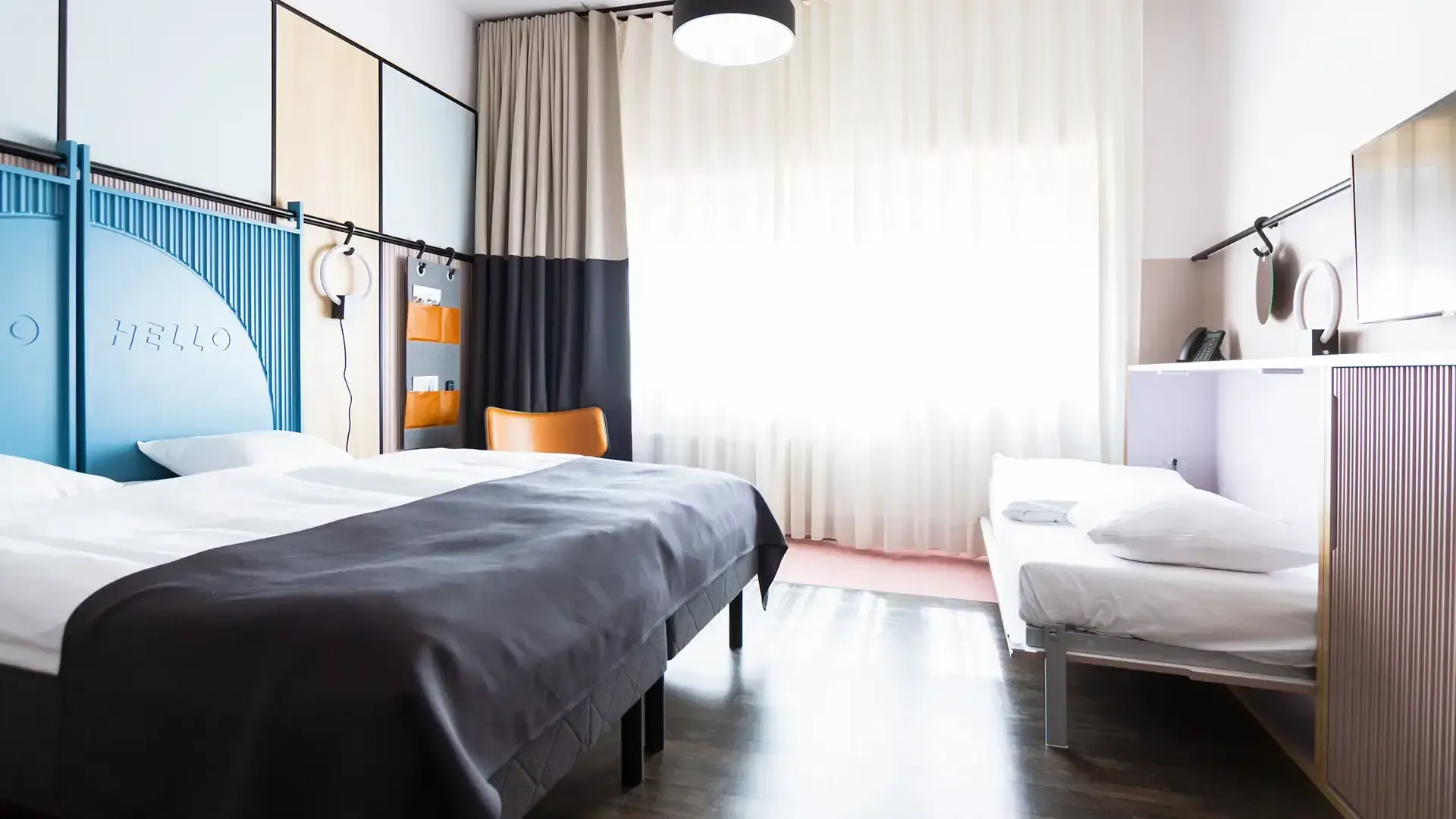 Family room in Nordic design with double bed and extra pull-out bed.