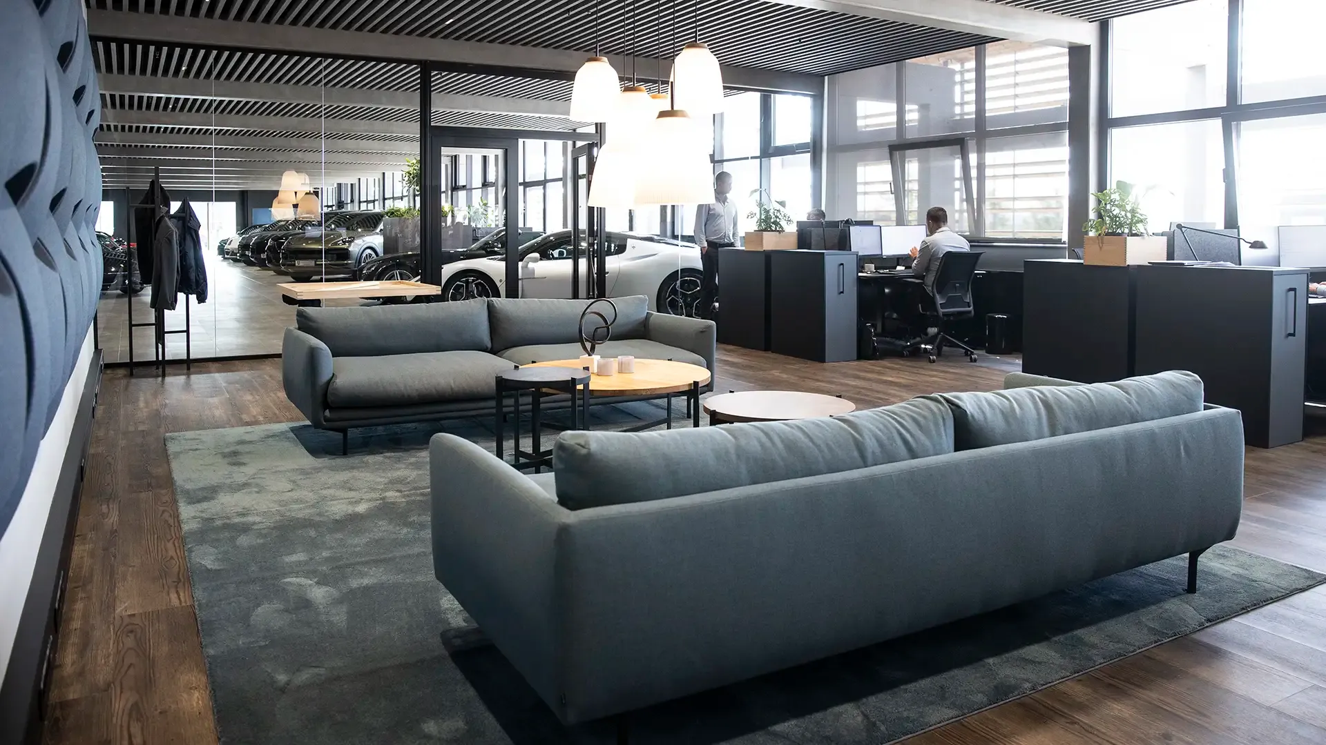 Office lounge area with Bolia sofas and coffee tables, combining functionality with exclusive interior design.