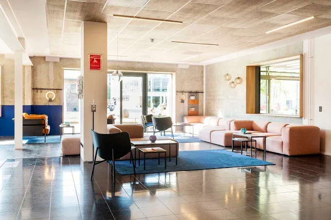 Modern hotel lobby with stylish seating and natural light