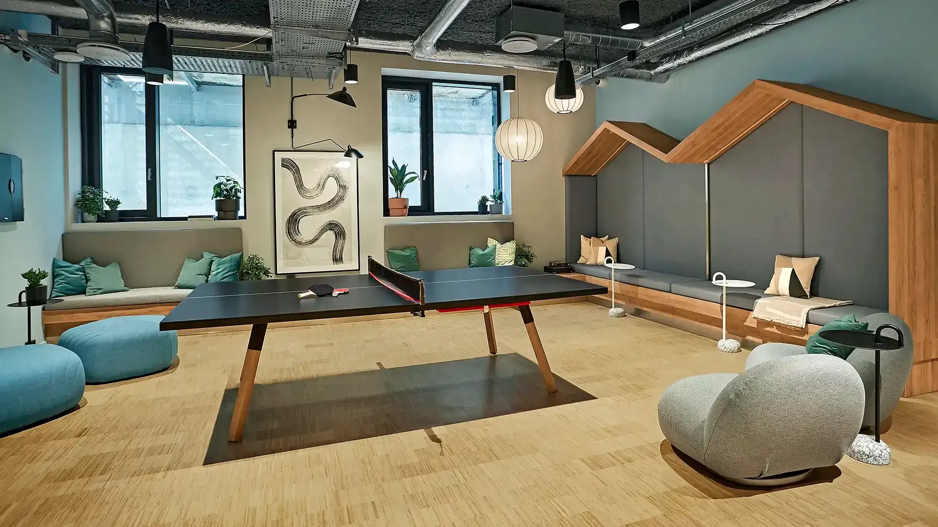 Student living common area gameroom industrial design with besoke furniture